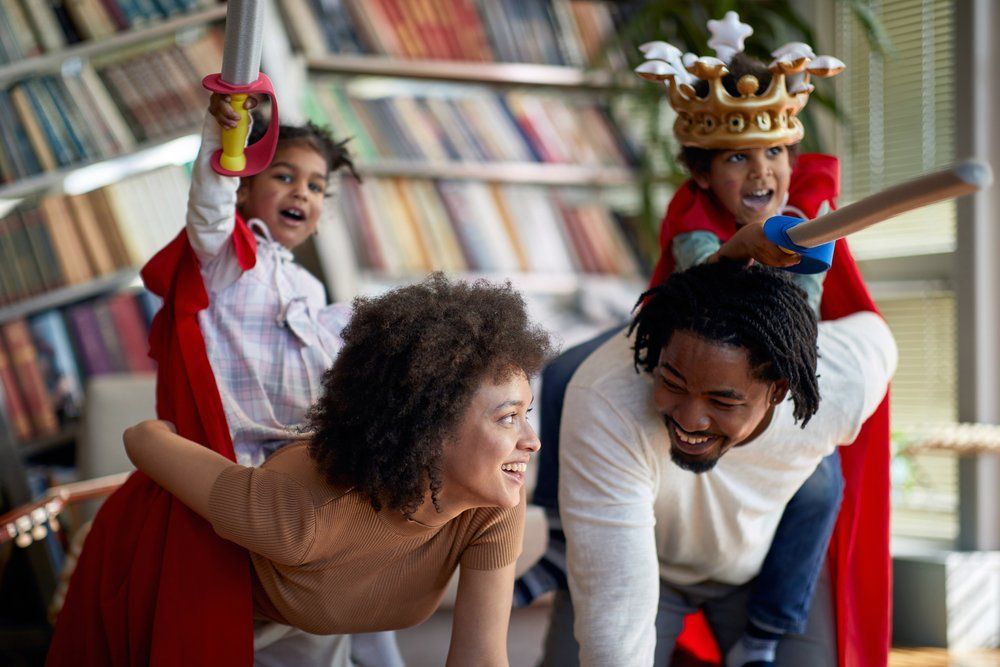 A family playing together, illustrating skill, creative and social play